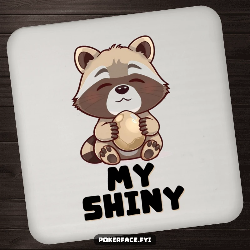 Funny Drink Coaster featuring a content raccoon holding a shiny pebble, adding collecting humor to tabletops.