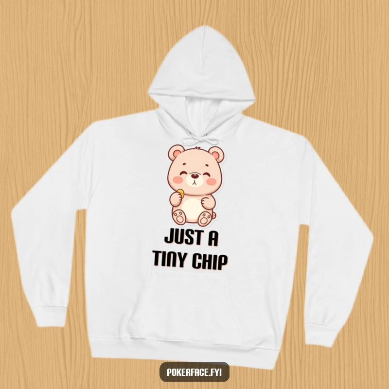 Funny hoodie graphic of a delighted bear with a neutral face, holding a tiny chip, exuding calm contentment.