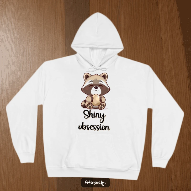 Funny Hoodie with a content raccoon holding a shiny pebble, perfect for cozying up and celebrating collections.